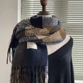 Detail of blue and brown plaid scarf featuring soft cashmere-like texture and fringed edges - Colored Plaid in Navy Blue