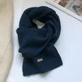 Detailed texture of dark blue 100% Australian wool scarf with stitched fabric label - Dark Blue