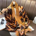 Detail of colorful wave pattern scarf with fringe edge on a brown leather sofa - 180*90CM / Coffee
