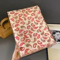 Detail of white and red paisley cotton linen scarf with elegant gold stamping and fringe - Red