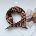 Detailed close-up of floral cotton linen scarf with elegant beige lace trim edges - Red Flower
