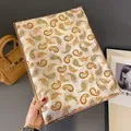 Elegant ivory pashmina with golden paisley print and delicate fringe edges - Khaki