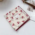 Macro view of cotton square scarf with red cherry print and burgundy lace edges - Cherry Red