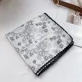 Detailed macro of 100% cotton floral handkerchief with intricate black lace borders - 70x70cm / Vine Floral White