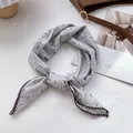 Detail of floral cotton square scarf featuring elegant crochet lace edges in retro style - One Size / Light Gray