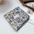 Detailed close-up of 100% cotton floral scarf with delicate navy crochet lace edge - Blue Floral