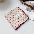 Detail of white cotton bandana with red polka dots and decorative crochet lace trim - Polka Dot Red