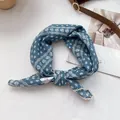 Detail view of blue floral headscarf with delicate white lace trim and chiffon texture - 70*70cm / Aqua