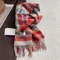 Detail of red and grey plaid 100% wool scarf featuring fringe tassels and brand label - 180*30cm / Red