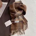 Detail of classic plaid wool scarf featuring brown fringes and brand woven label - 180*30cm / Brown
