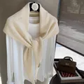 Elegant beige knit shawl layered over a white long-sleeve tee for a chic spring look - Off White