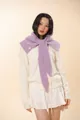 Detail of purple knitted balaclava neck warmer featuring white buttons and fuzzy texture - Taro Purple