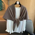 Detailed close-up of premium 100% wool triangular scarf styled over a white shirt - Camel