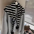 Cute black and white striped knitted scarf with pom-pom details and warm autumn texture - Black