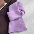 Detail of lavender wool knit scarf with thick vertical ribs and branded patch on wool - Lavender
