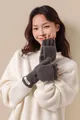 Detail of wool blend fingerless mittens in dark brown featuring a flip-top and woven label - Gray