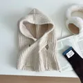 Close-up of beige chunky knit balaclava hat with soft winter home lifestyle accessories - Off White