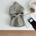 Detail of grey knitted balaclava with ribbed texture and soft fabric for winter warmth - Apricot
