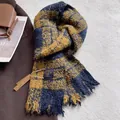 Detail of blue and yellow checkered scarf with fringes and minimalist brand label - Navy Blue