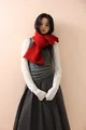 Red chunky knit scarf with button detail worn with a stylish winter layered outfit - Red