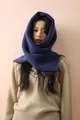 Close-up of a deep blue wool-blend balaclava featuring soft knit texture and wood buttons - Royal Blue