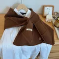 Dark brown chunky knit scarf with button detail and soft plush texture on white shirt - Coffee