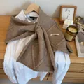Coffee brown cable knit shawl with button detail and weave texture over a white shirt - Khaki