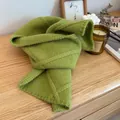 Knitted green scarf with cable stitch pattern and button design in cozy casual setting - Green