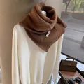 Detailed close-up of dark brown textured wool scarf with BONOGEED label and button detail - Cocoa Brown