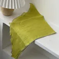 Detail of yellow-green linen scarf texture with grey overlock stitched edge on white surface - Solid Yellow