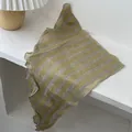 Close-up of olive yellow and grey striped linen scarf with breathable sheer texture - Yellow Plaid