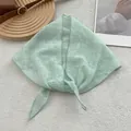 Detail of light green floral lace headscarf with refined square pattern texture - Green