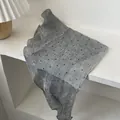 Detail of grey polka dot linen scarf showing delicate fabric texture and hem finish - Polka Dot Grey