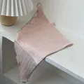 Close-up of light pink cotton-linen scarf showing high-quality texture and dark stitched edges - Solid Pink