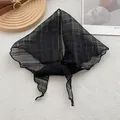 Detail of black semi-transparent linen headscarf with soft pleated texture on white background - 28x115cm / Black