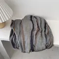Detailed close-up of textured vertical stripes and pleated fabric on a cotton linen shawl - 180x90cm / Blue