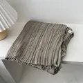 Detailed view of dark beige pleated cotton linen scarf featuring natural fringe edges - 180*90CM / Flaxen