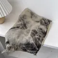 Macro detail of tie-dye wool scarf with artisanal fringe edges on a white wood surface - 180x90cm / Dark Brown