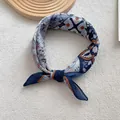 Close-up of a floral cotton linen square scarf with vintage blue totem patterns - Navy Blue