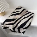 Close-up of zebra pattern scarf showing soft fabric texture and fine fringe details - 180x60cm / Off White