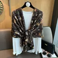 Detail of dark brown cotton shawl featuring cute cat prints and delicate fringed edges - 180cm x 70cm / Coffee