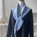 Light blue knit triangle shawl scarf layered over a black blazer in a minimalist interior - 100*30cm / Light Blue