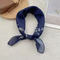 Detailed bow-tie knot on navy floral scarf with white lily of the valley print - 70cmx70cm / Navy Blue