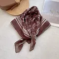 Detail of vintage floral silk scarf with geometric border on minimalist aesthetic background - 70cmx70cm / Coffee