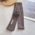 Detail of a brown knitted skinny scarf featuring a handmade fabric 3D rose accent - 3D Rose Flower Style / Coffee