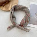 Detail of floral linen headscarf with vintage pattern on a soft white background - 70x70cm / Hundred Flowers