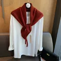 Women's 100% wool hollow knit triangle shawl scarf over white long sleeve tee shirt - Red