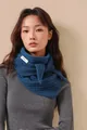 Close-up of 100% pure wool label on a navy blue fishbone knit shawl for women - Interstellar Blue