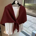 Deep burgundy wool blend knit shawl layered over a white top for autumn winter style - Red