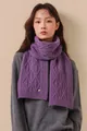 Macro detail of purple cable knit merino wool scarf with colorful fiber flecks - Purple